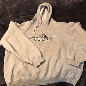 Grey adidas hooded sweatshirt that is lived in size large